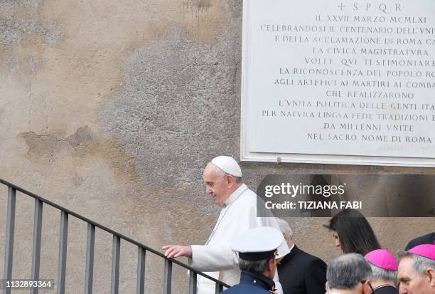 Rome mayor Virginia Raggi escorts Pope Francis upon his arrival for a visit at Rome's City all on Capitoline Hill on March 26, 2019.