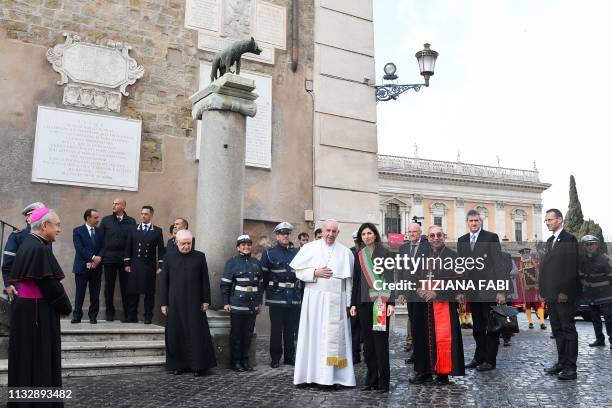 Rome mayor Virginia Raggi greets Pope Francis and Vicar General of Rome, Italian prelate Angelo De Donatis upon their arrival for a visit at Rome's...