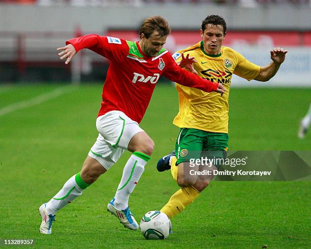 Dmitri Sychev of FC Lokomotiv Moscow battles for the ball with Maksim Zhavnerchik of FC Kuban Krasnodar during the Russian Football League...