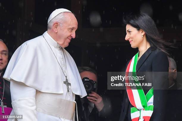 Rome mayor Virginia Raggi greets Pope Francis upon his arrival for a visit to Rome's City Hall on Capitoline Hill on March 26, 2019.