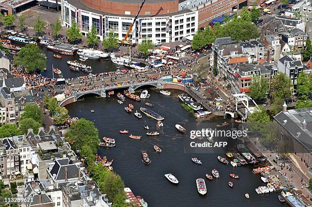 An aerial of Amsterdam shows the crowd gathering during Queensday on April 30, 2011 in Amsterdam. AFP PHOTO / ANP / BRAM VAN DE BIEZEN netherlands...