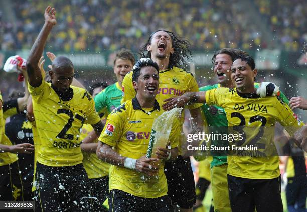Lucas Barrios, Kevin Grosskreutz, Antonio Da Silva and Felipe Santana of Dortmund celebrates winning the league title at the end of the Bundesliga...
