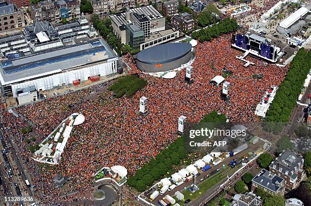 An aerial of Amsterdam shows the crowd gathering during Queensday on April 30, 2011 in Amsterdam. AFP PHOTO / ANP / BRAM VAN DE BIEZEN netherlands...