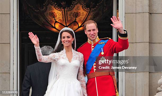 Prince William, Duke of Cambridge and Catherine, Duchess of Cambridge greet crowd of admirers from the balcony of Buckingham Palace on April 29, 2011...