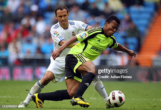 Ricardo Carvalho of Real Madrid battles with Uche of Real Zaragoza during the La Liga match between Real Madrid and Real Zaragoza at Estadio Santiago...