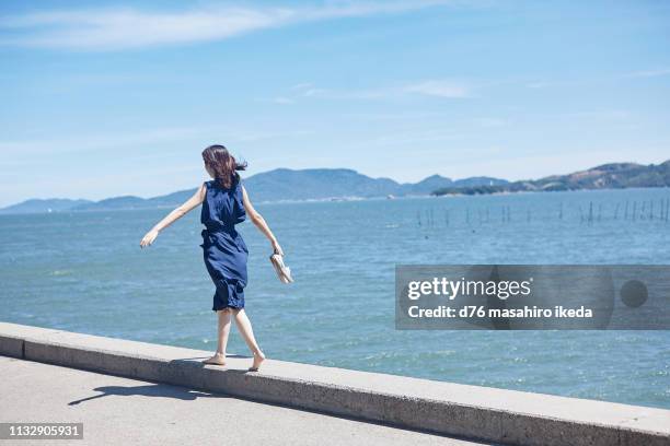 beautiful japanese women in her twenties - blue dress bildbanksfoton och bilder