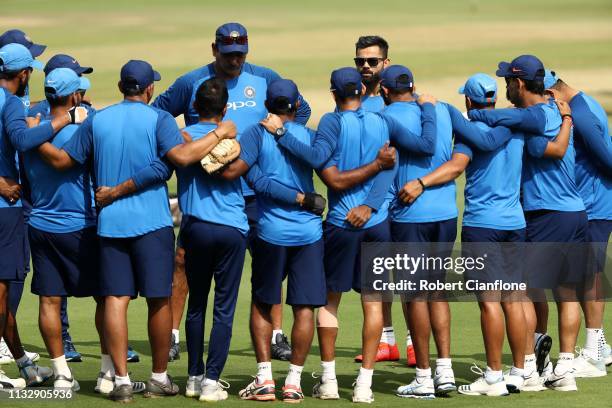 Ravi Shastri, coach of India and Virat Kohli of India speak to the team ahead of game one of the One Day International series between India and...