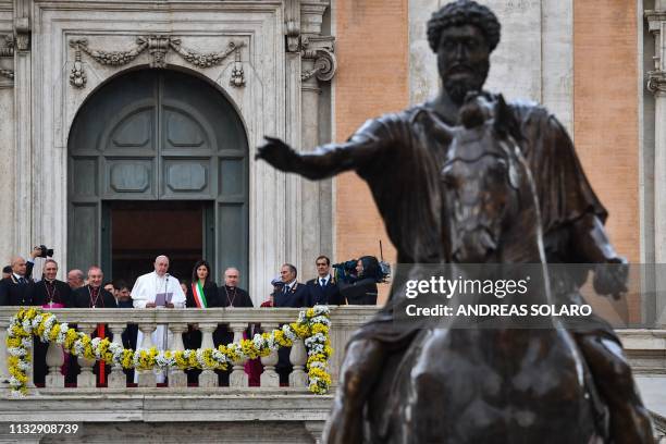 Pope Francis delivers an address from Rome's City Hall by an equestrian statue of Marcus Aurelius during a visit to Rome mayor Virginia Raggi on...