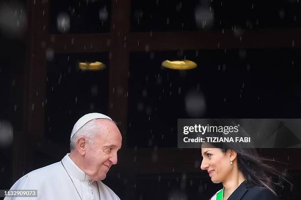 Rome mayor Virginia Raggi greets Pope Francis upon his arrival for a visit to Rome's City Hall on Capitoline Hill on March 26, 2019.