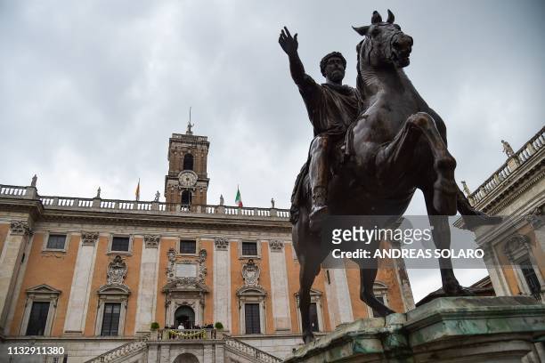 Pope Francis delivers an address from Rome's City Hall by an equestrian statue of Marcus Aurelius during a visit to Rome mayor Virginia Raggi on...