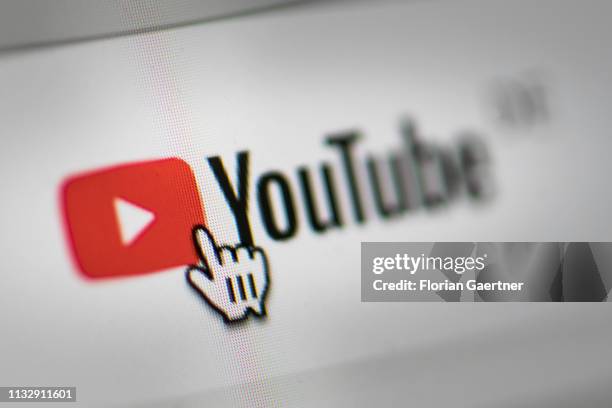In this photo illustration the mouse cursor is pictured on the YouTube logo on March 26, 2019 in Berlin, Germany.