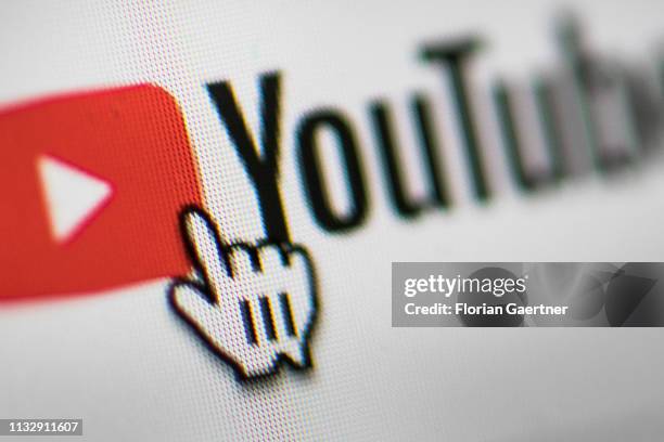 In this photo illustration the mouse cursor is pictured on the YouTube logo on March 26, 2019 in Berlin, Germany.