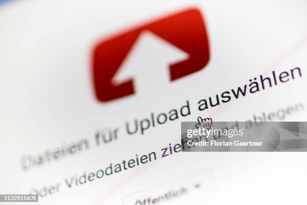 In this photo illustration the mouse cursor is pictured on the YouTube upload page on March 26, 2019 in Berlin, Germany.