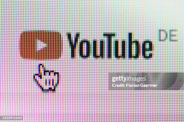 In this photo illustration the mouse cursor is pictured on the YouTube logo on March 26, 2019 in Berlin, Germany.