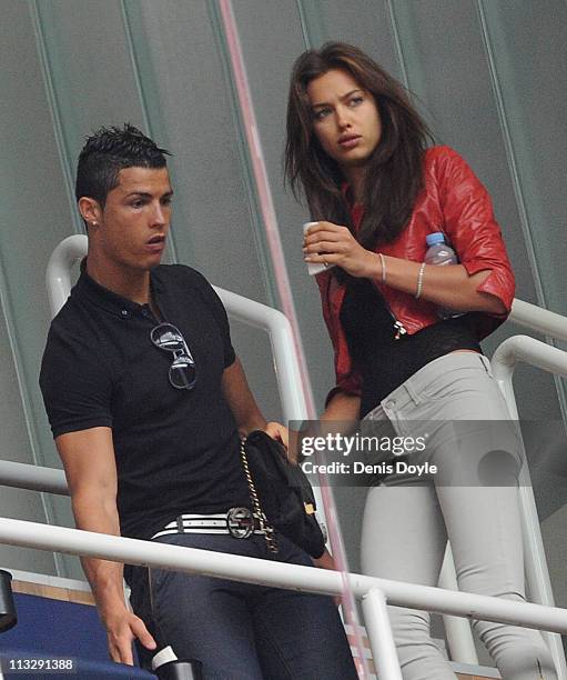 Cristiano Ronaldo of Real Madrid and his girlfriend Irina Shayk take to their seats before the start of the La Liga match between Real Madrid and...