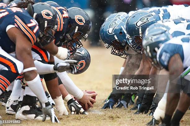 Players get in position at the line of scrimmage during an NFC Divisional Playoff Game between the Chicago Bears and the Seattle Seahawks at Soldier...
