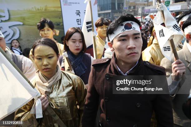 South Korean performers participate in a re-enactment of the historic March First Independence Movement against Japanese during the 100th...