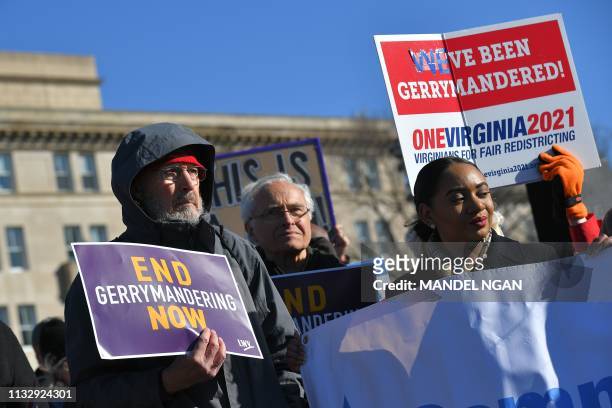 People gather during a rally to coincide with the Supreme Court hearings on the redistricting cases in Maryland and North Carolina, in front of the...
