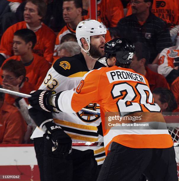 Chris Pronger of the Philadelphia Flyers and Zdeno Chara of the Boston Bruins battle in Game One of the Eastern Conference Semifinals during the 2011...