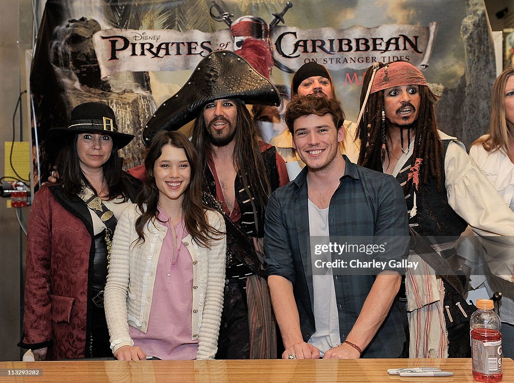 "Pirates of the Caribbean: On Stranger Tides" Cast Astrid Berges-Frisbey And Sam Claflin Visit Hot Topic Store In Hollywood
