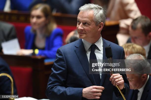 French Economy and Finance Minister Bruno Le Maire looks on as he prepares to speak during a session of questions to the government at the National...