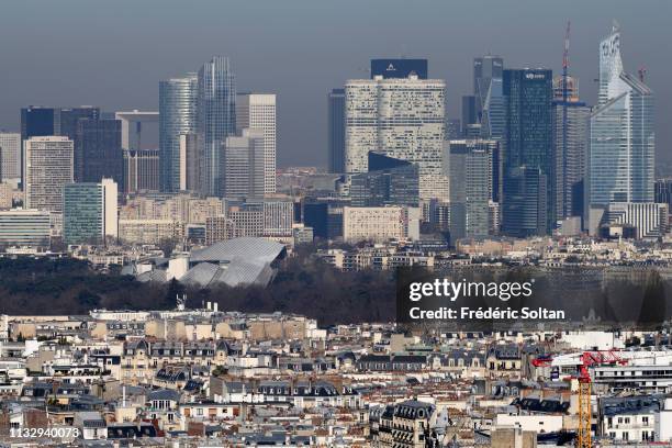 Aerial view of Paris and La Défense area, a major business district of the Paris Metropolitan Area and of the Île-de-France region on the banks of...