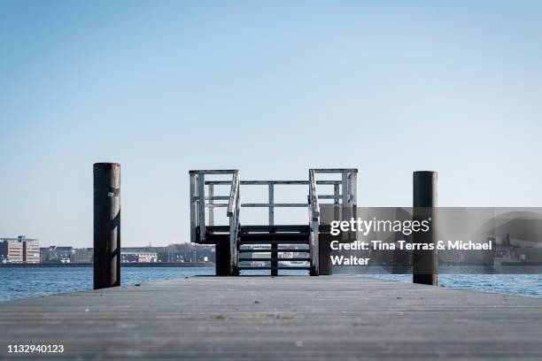 boardwalk at the coast in kiel (germany) - abgeschiedenheit stock pictures, royalty-free photos & images