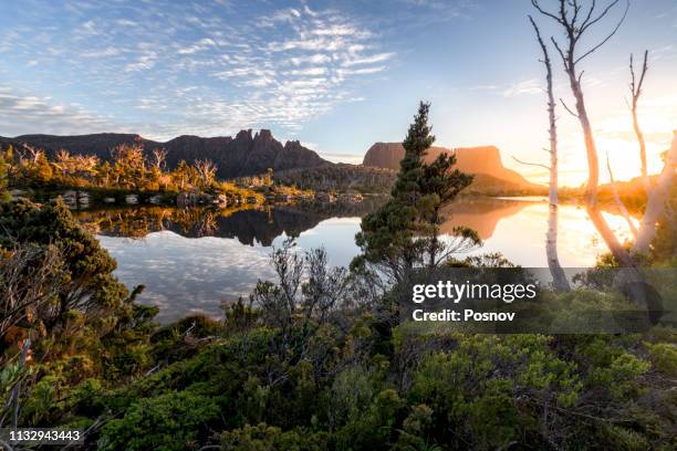 sunrise over lake elysia - overland track stock pictures, royalty-free photos & images