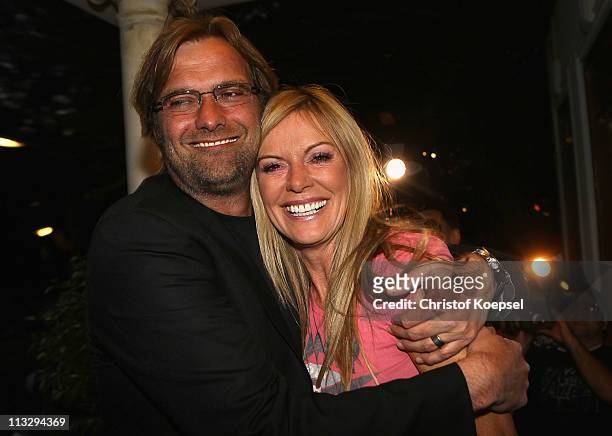 Head coach Juergen Klopp and his wife Ulla Klopp pose afterwinning the German Championships at a restaurant on April 30, 2011 in Dortmund, Germany.