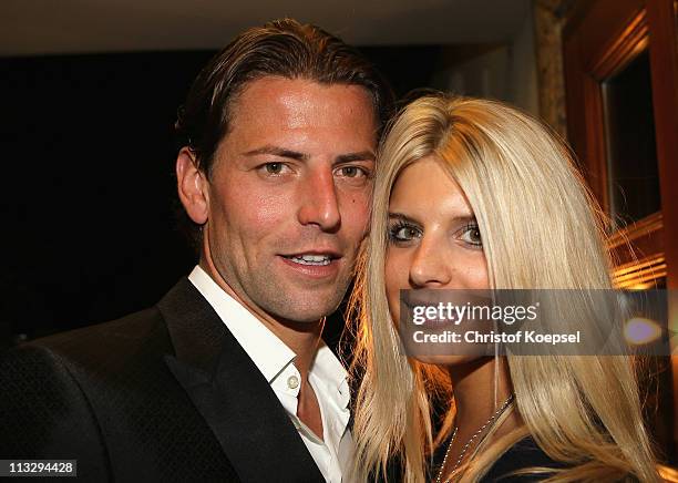 Roman Weidenfeller and his girl-friend Lisa pose before celebrate winning the German Championships at a restaurant on April 30, 2011 in Dortmund,...