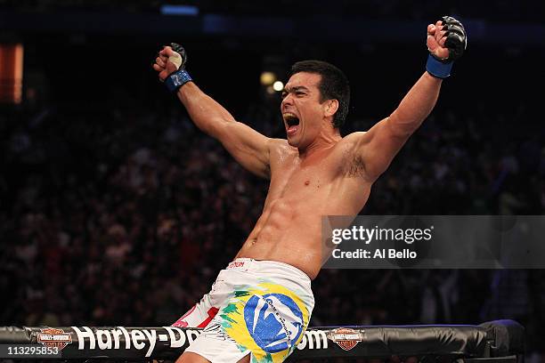 Lyoto Machida celebrates defeating Randy Couture by knockout in the second round of their Light Heavyweight bout at UFC 129 in the Rogers Centre on...