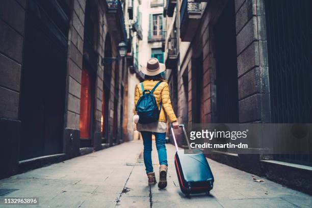 tourist visiting spain - yellow suitcase stock pictures, royalty-free photos & images