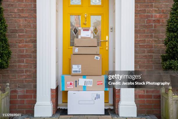 packages delivered to house - welcome mat stock pictures, royalty-free photos & images