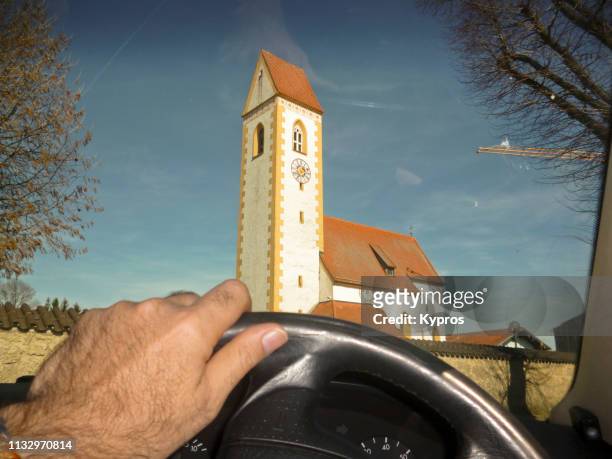 europe, germany, bavaria: view of bavarian church through sports car windscreen - spire stock pictures, royalty-free photos & images