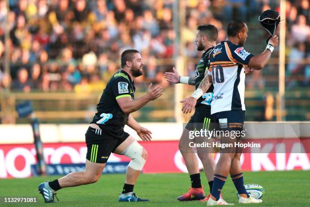 Dane Coles of the Hurricanes celebrates with TJ Perenara after scoring a try during the round three Super Rugby match between the Hurricanes and the...
