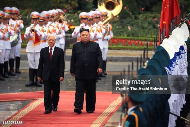 North Korean leader Kim Jong-un attends the welcome ceremony with Vietnamese President Nguyen Phu Trong at the Presidential Palace on March 01, 2019...
