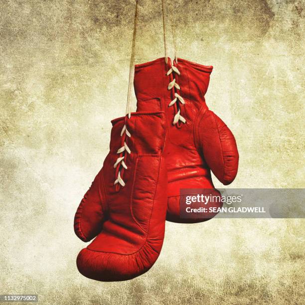 red laced boxing gloves - boxing poster stock pictures, royalty-free photos & images