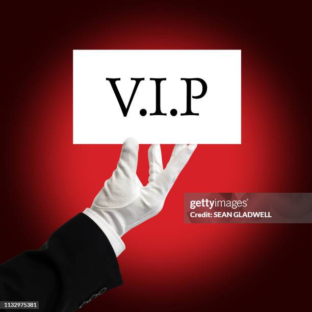 butler holding vip pass card - vip pass stock pictures, royalty-free photos & images