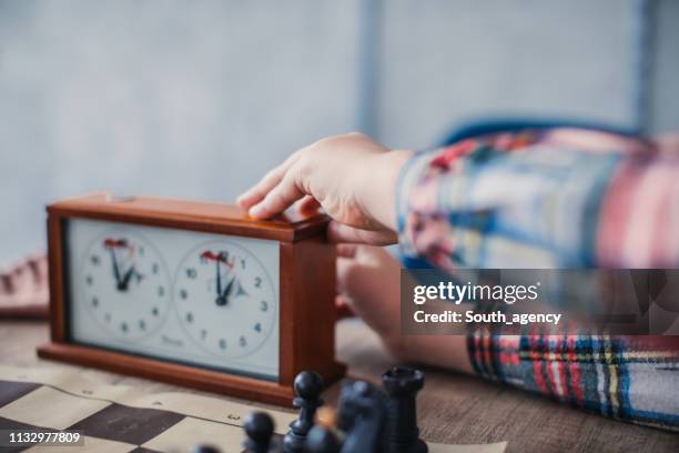 time to make a move in game of chess - chess timer stock pictures, royalty-free photos & images