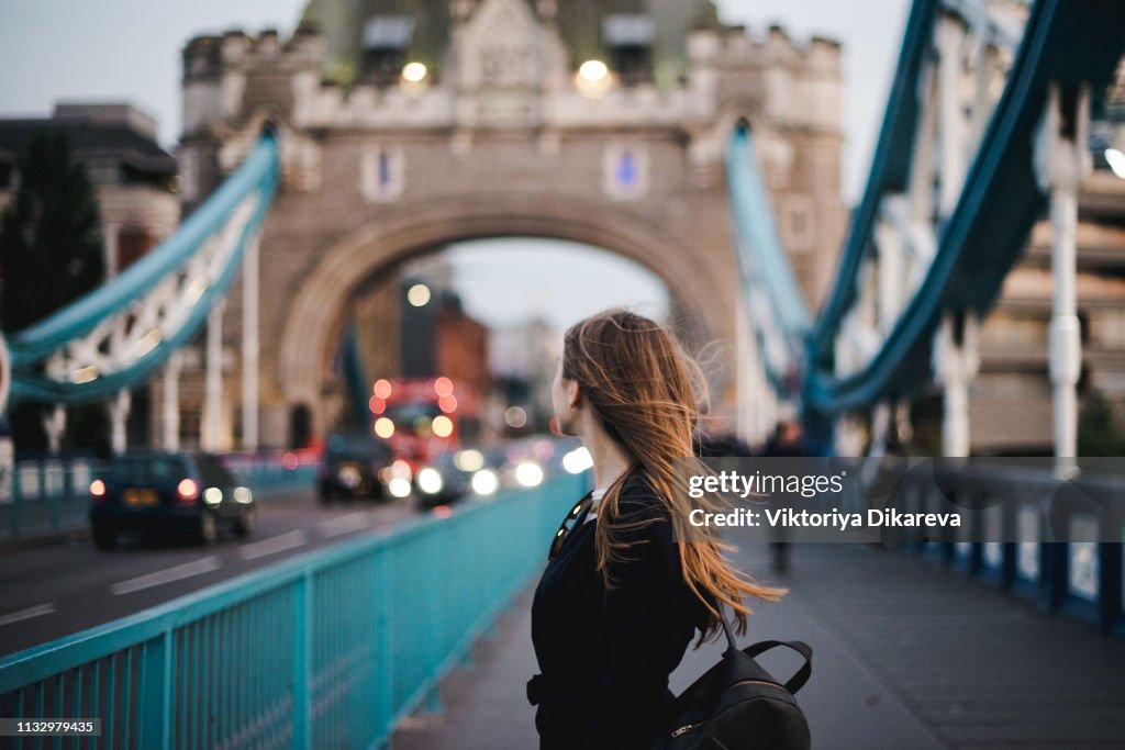 Young girl discovery London - Tower bridge. London Tourist.