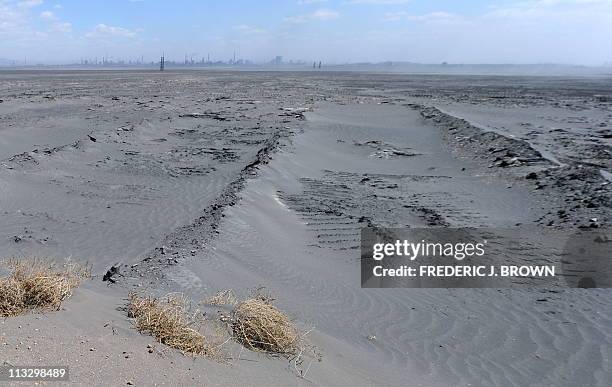 Vast expanse of toxic waste fills the tailings dam on April 21 frequently whipped up by strong winds dumping mllions of tonnes of radioactive...