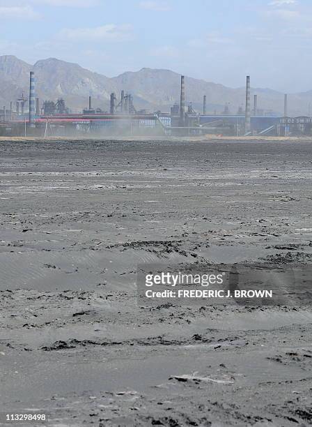 Vast expanse of toxic waste fills the tailings dam on April 21 frequently whipped up by strong winds dumping mllions of tonnes of radioactive...