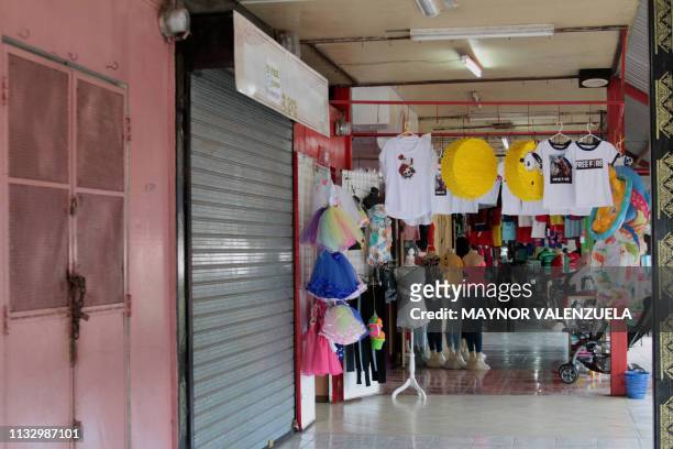 Picture taken at the Roberto Huembes market in Managua where some stalls remain closed, on March 26, 2019. - The political tension has exacerbated...