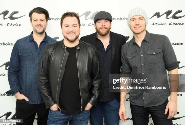 Chris Thompson, Mike Eli, James Young and Jon Jones of the Eli Young Band Visit Music Choice at Music Choice on March 01, 2019 in New York City.