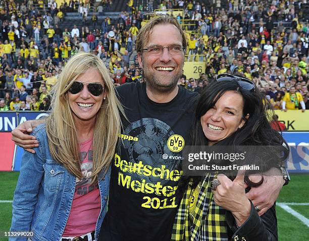 Juergen Klopp, head coach of Dortmund celebrateswith his wife Ulla and a friend, winning the league title at the end of the Bundesliga match between...