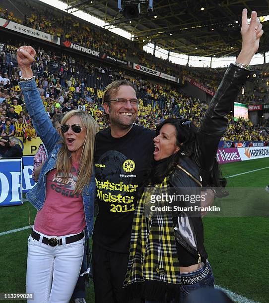 Juergen Klopp, head coach of Dortmund celebrateswith his wife Ulla and a friend, winning the league title at the end of the Bundesliga match between...