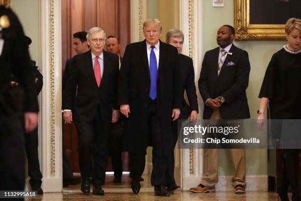 President Donald Trump arrives at the U.S. Capitol alongside U.S. Senate Majority Leader Sen. Mitch McConnell and Sen. Roy Blunt before joining...