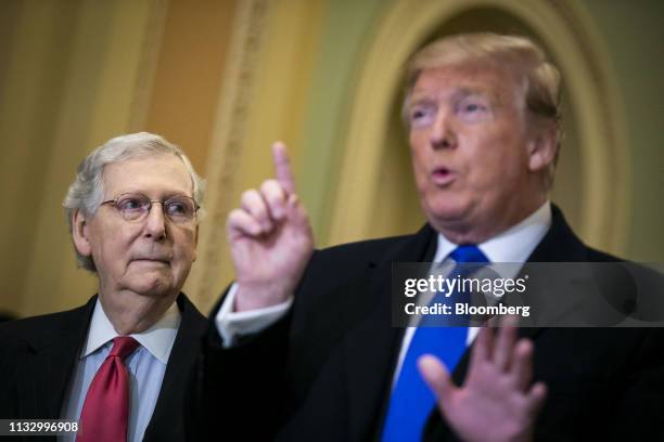 Senate Majority Leader Mitch McConnell, a Republican from Kentucky, left, listens while U.S. President Donald Trump speaks to members of the media...