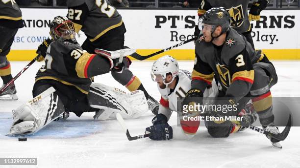 Jonathan Huberdeau of the Florida Panthers scores a third-period goal against Malcolm Subban and Brayden McNabb of the Vegas Golden Knights during...