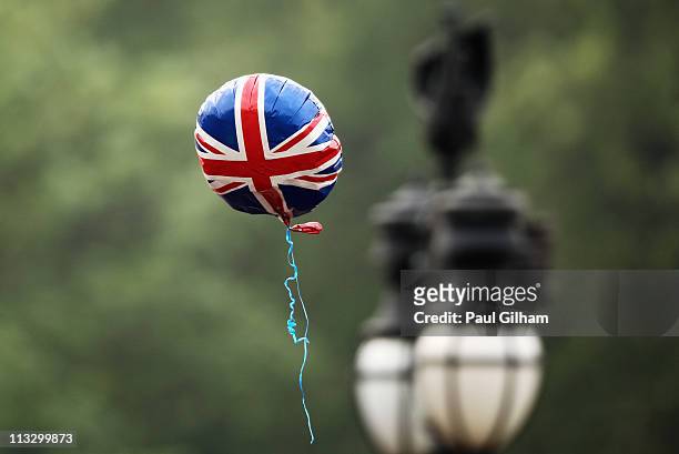 Well-wishers balloon is seen flying outside Buckingham Palace after Prince William and Princess Catherine greeted well-wishers from the balcony at...